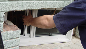 Installing new windows in a Sicklerville finished basement