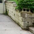 a collapsing retaining wall in Millville