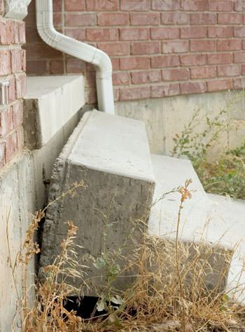 sinking outdoor concrete steps showing cracking and soil washout in Ocean City