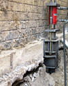 A completed installation of foundation push piers lifting a foundation in Cape May