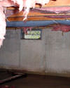 New Jersey and Pennsylvania crawl space with vents, showing mold, rot, and fiberglass insulation dripping off the ceiling.