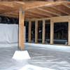 A large, encapsulated crawl space with our vapor barrier system installed in Cherry Hill.
