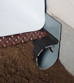 Closeup of a crawl space drainage system installed in Egg Harbor City