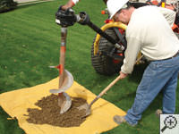 Auguring a hole in the earth for a foundation repair in Williamstown