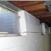 A foundation showing severe inward buckling along the windows in a Voorhees home.