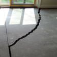 a huge crack in a concrete slab floor in Clementon