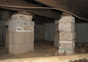 crawl space repairs done with concrete cinder blocks and wood shims in a Mays Landing home