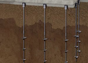 A graphic illustration of steel helical piers supporting a home foundation.