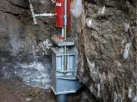 Foundation repair contractors lifting a structure in Sicklerville.
