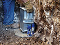 Securing a foundation footing bracket for a foundation repair system in Chester.