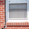 A gap in a window along the outer wall due to foundation settlement of a Egg Harbor Township home.