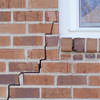 long jagged cracks starting at the corner of a window along a brick wall on a Mays Landing home