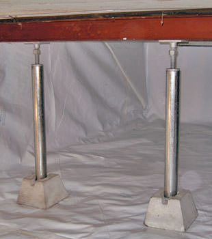 Crawl space jack posts installed in conjunction with a crawl space vapor barrier in Egg Harbor City