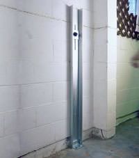 A failing foundation wall repaired with a foundation wall channel anchor system in a Philadelphia home.