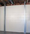 A steel i-beam system installed on a Margate City foundation wall