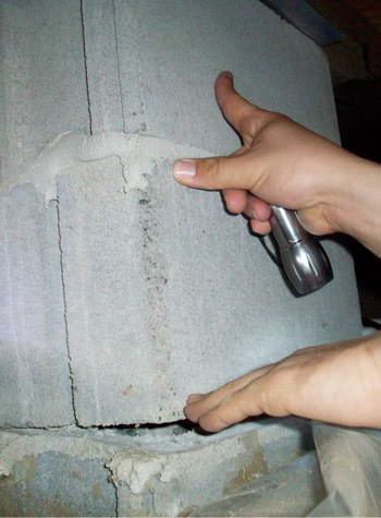a completely failing concrete crawl space support pillar in Brigantine
