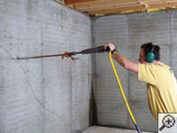Coring a hole in a block wall foundation for an earth anchor installation