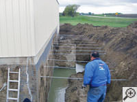 Drilling the hole in the foundation wall for street creep repairs in Pleasantville