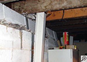 A failing foundation wall and i-beam support in a Vineland home