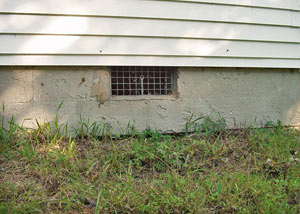 Open crawl space vents that let rodents, termites, and other pests in a home in Chester
