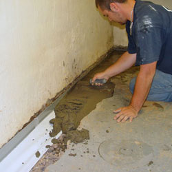 Testing a French drain system in a Millville home.