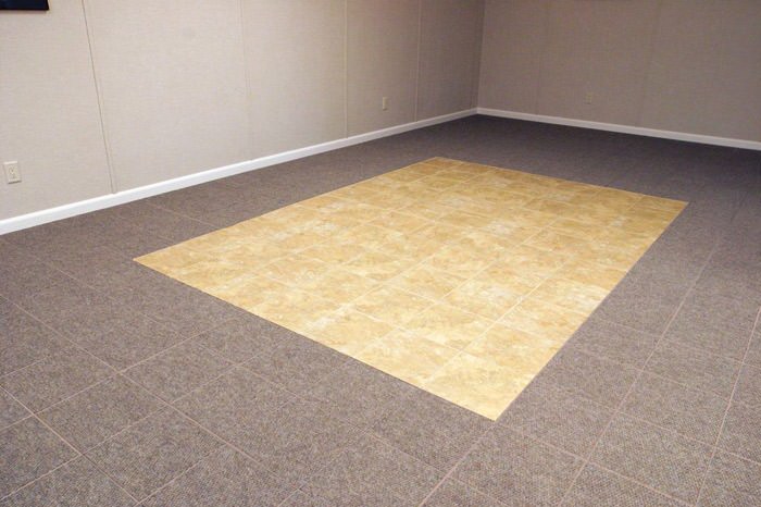 tiled and carpeted basement flooring installed in a Bridgeton home
