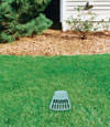 A buried gutter drain downspout extension installed in a Brigantine home