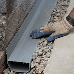 installing a drain tile system in a Cape May home
